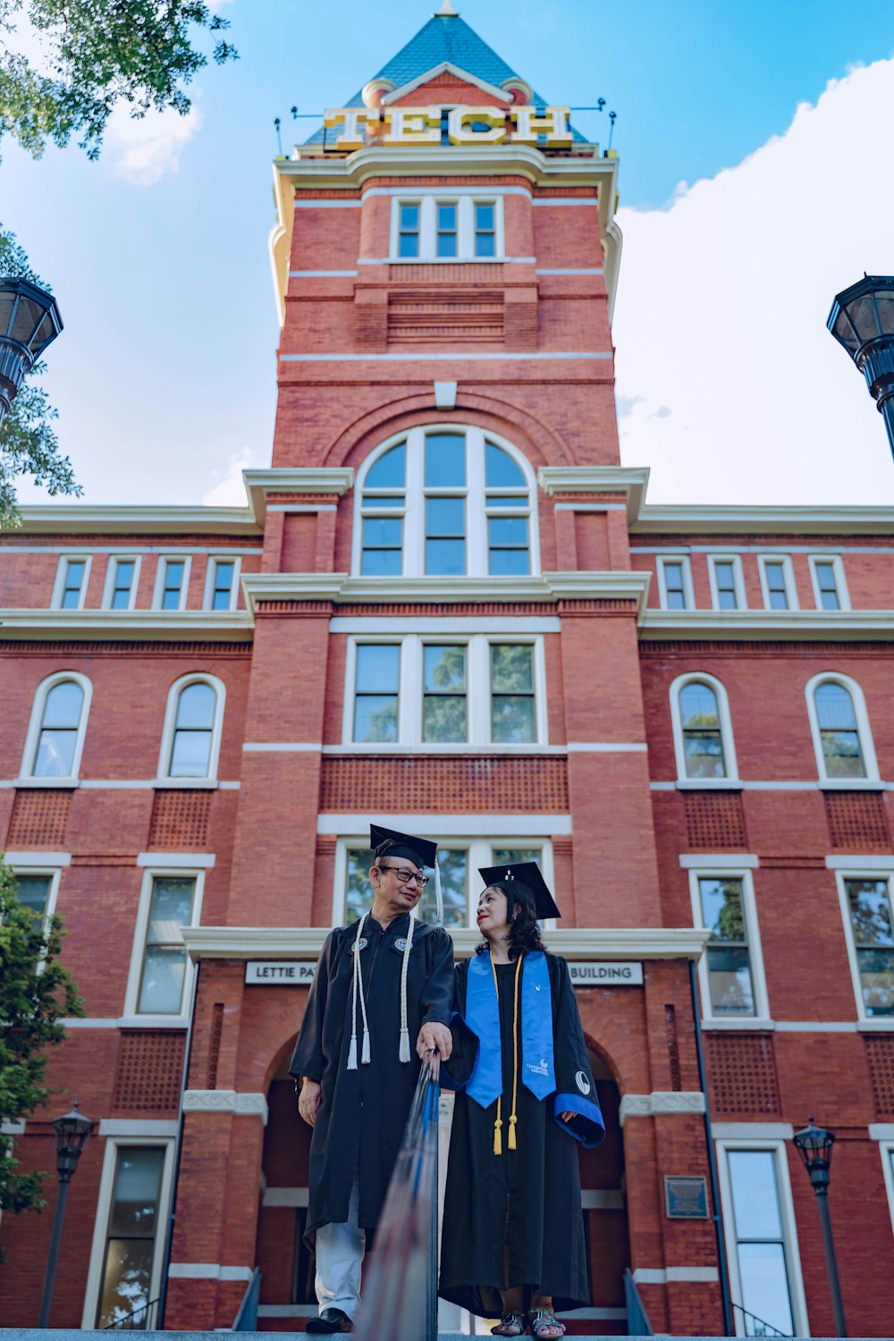 man and woman standing near building