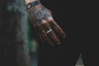 a man with a ring on his left hand