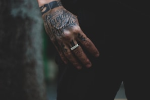 a man with a ring on his left hand