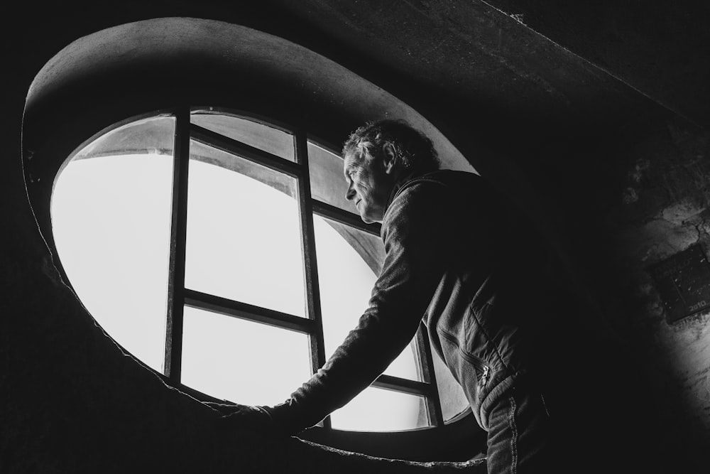 man standing near window