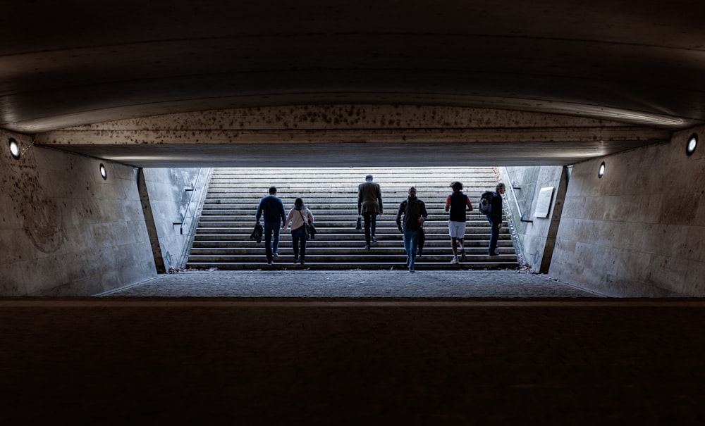 people walking on concrete stairway