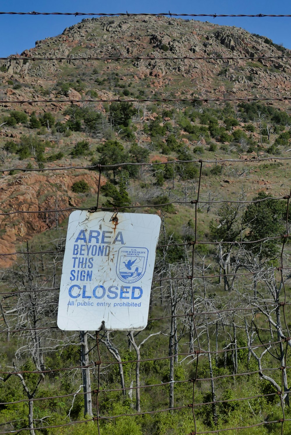 a sign that is on the side of a fence