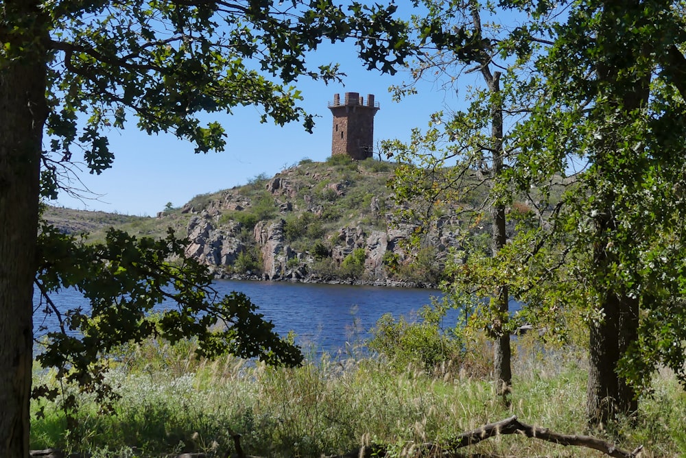 tower on grass mountain island during day