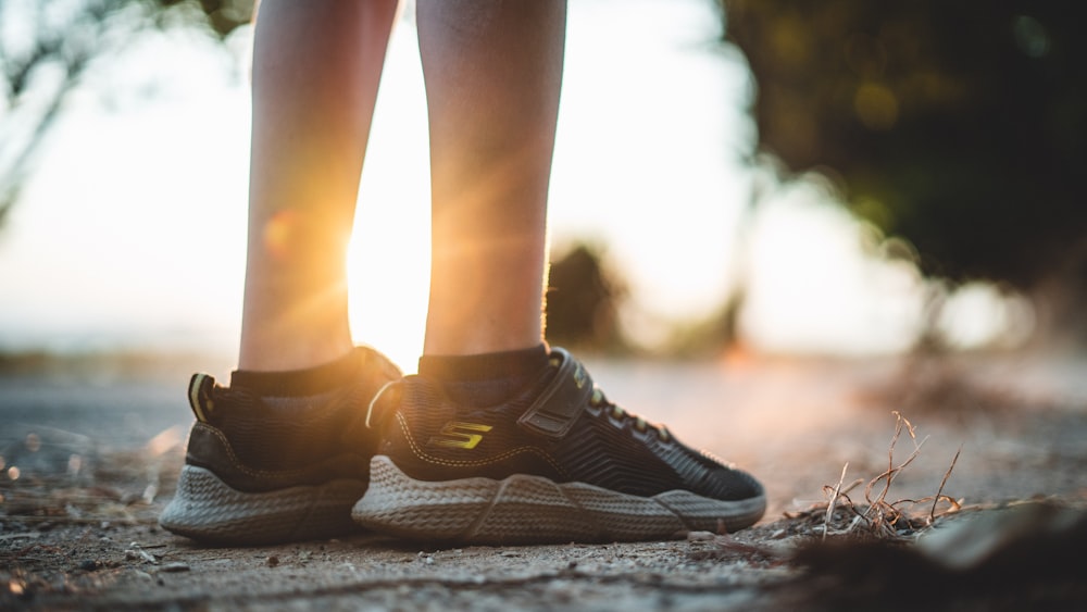 pair of black Skechers athletic shoes