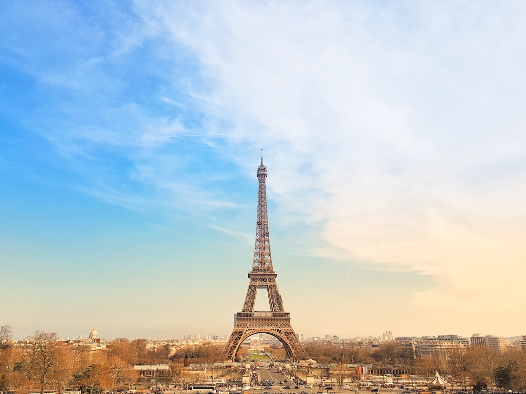 the eiffel tower towering over the city of paris, Morning at the Eiffel Tower
