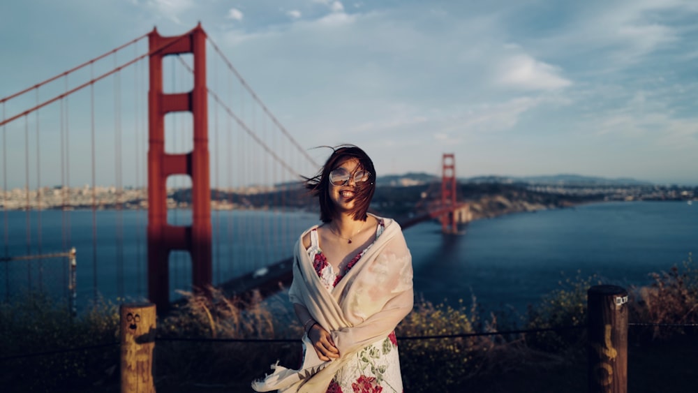 woman standing near Golden Gate Bridge during daytime