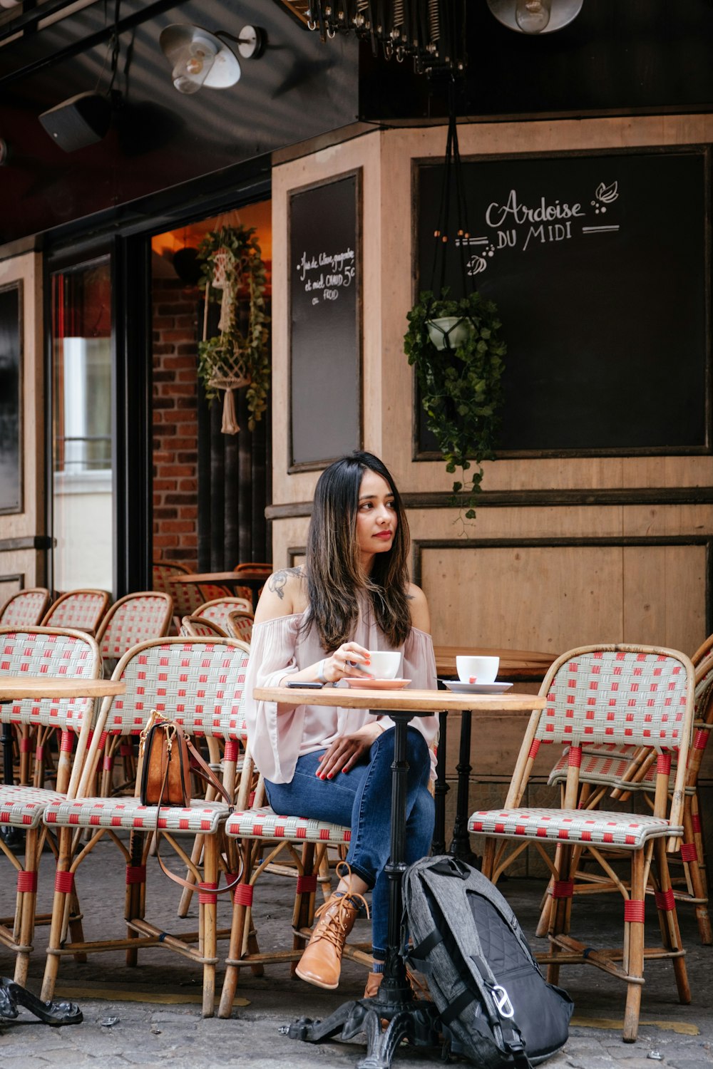 woman sitting on chair beside table