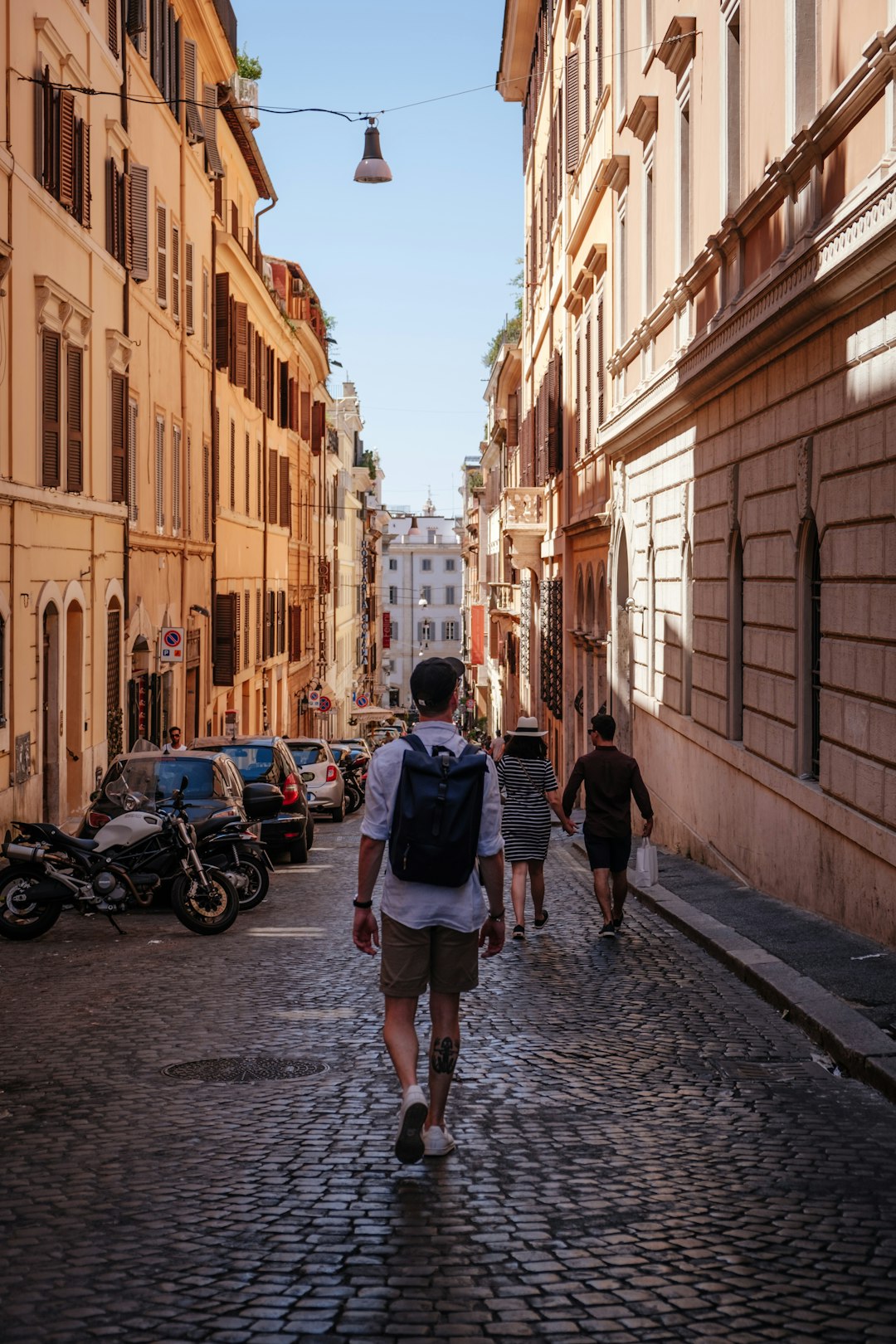 man walking in the middle of the street