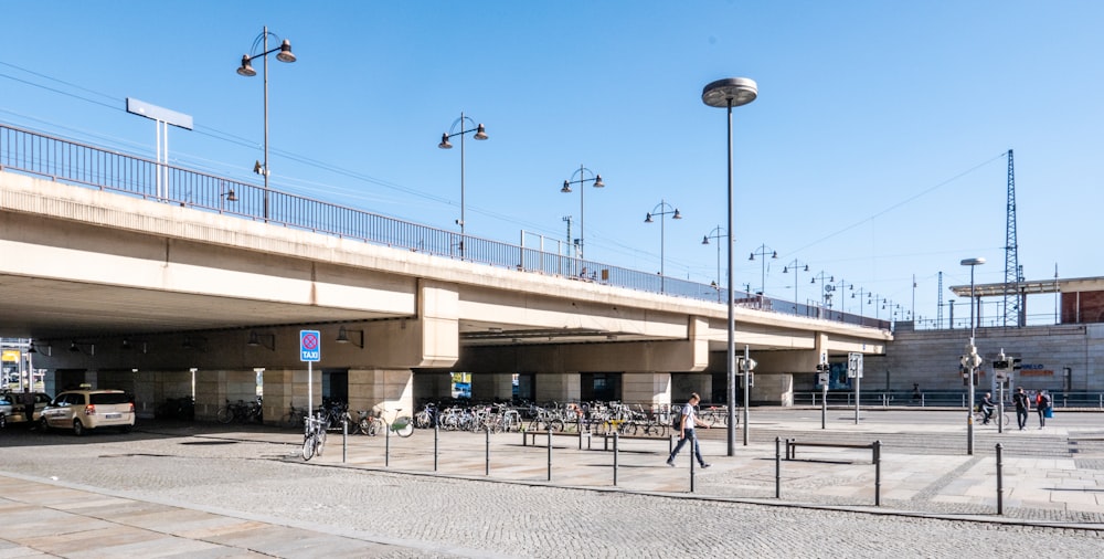 white concrete bridge under blue sky