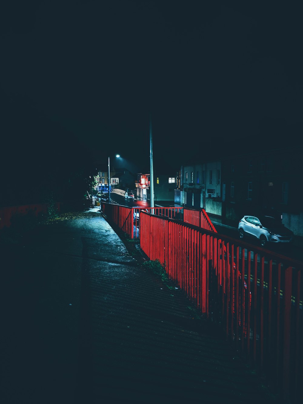 red metal railing at night
