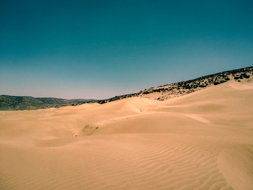 brown desert under blue sky