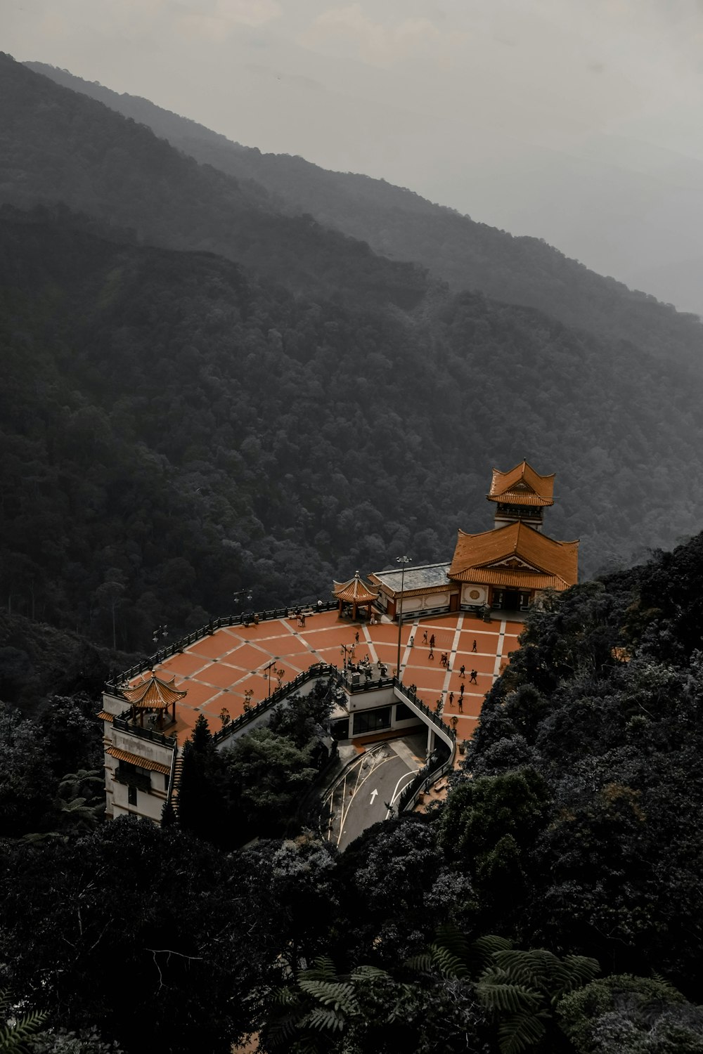 brown and white building on mountain