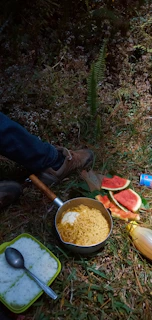 A picnic scene with friends enjoying Hinature banana chips outdoors surrounded by nature