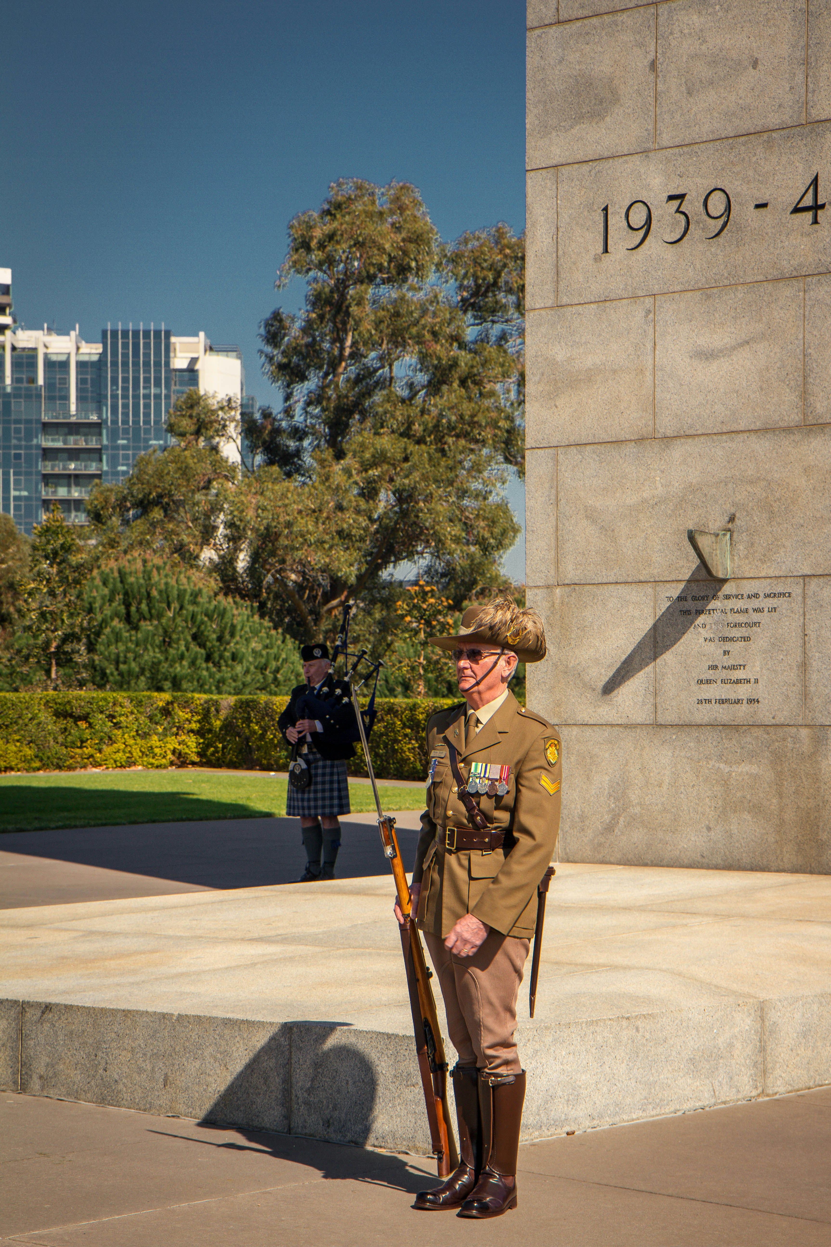 man wearing bornw military suit