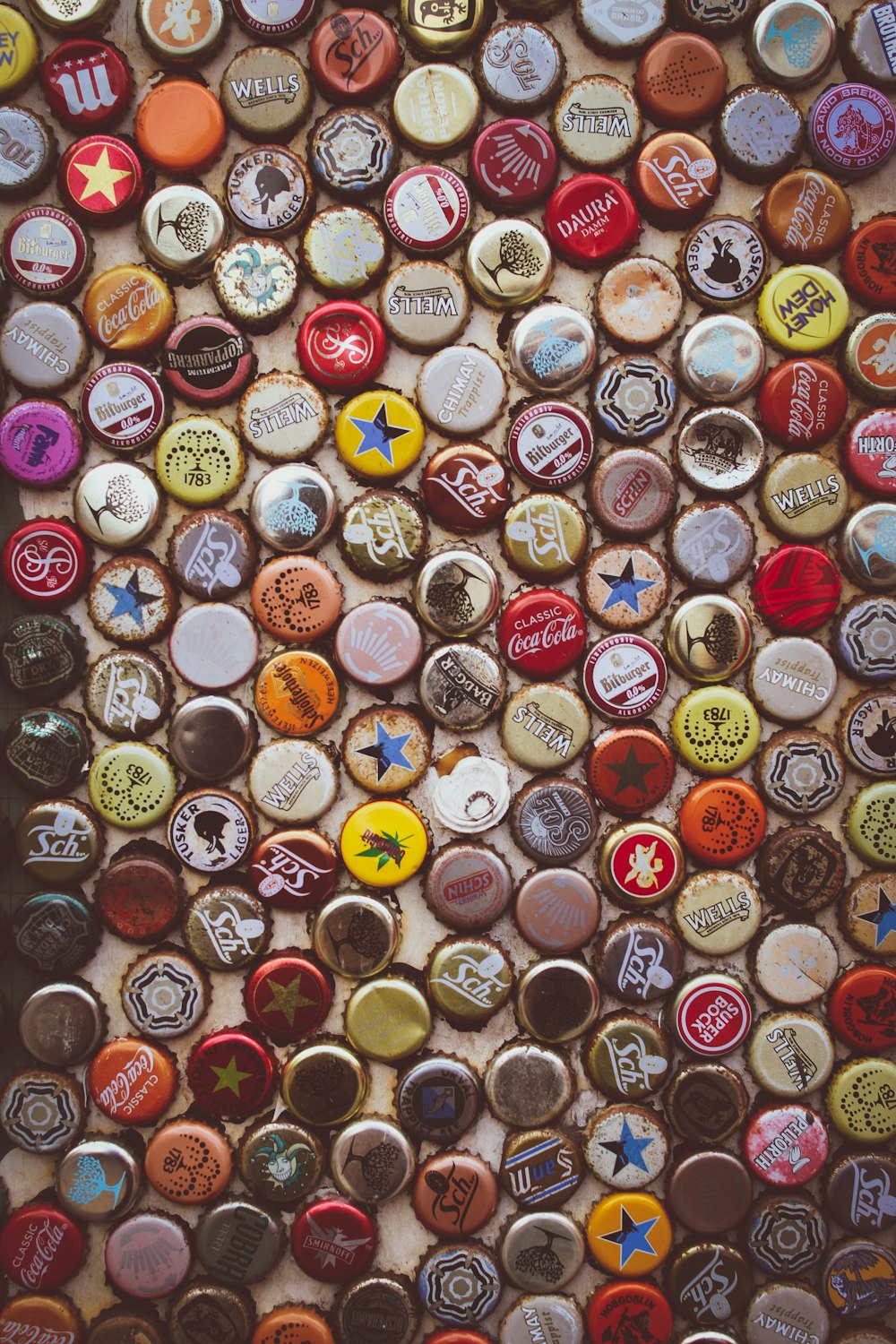 assorted-color-and-label bottle cap lot