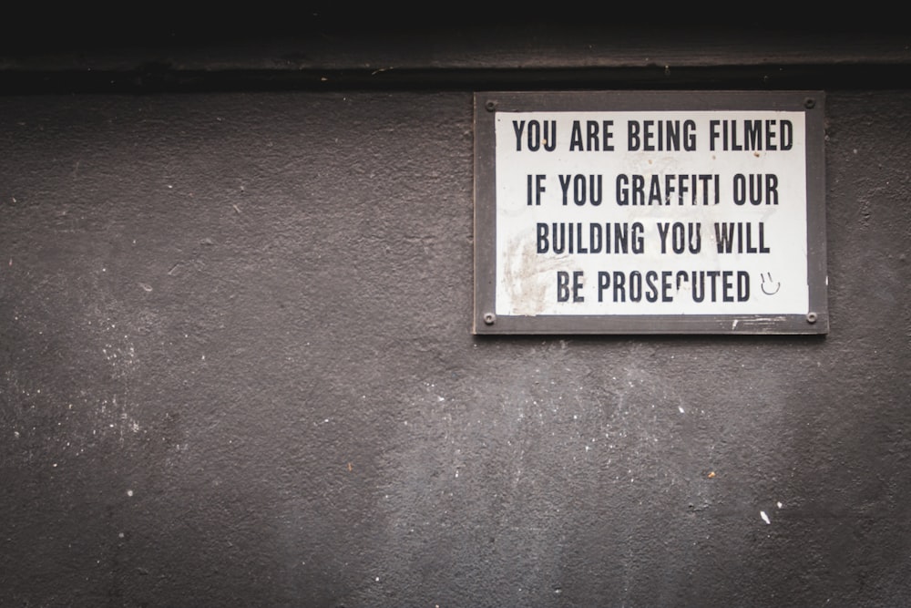 you are being filmed if you graffiti our building you will be prosecuted signage