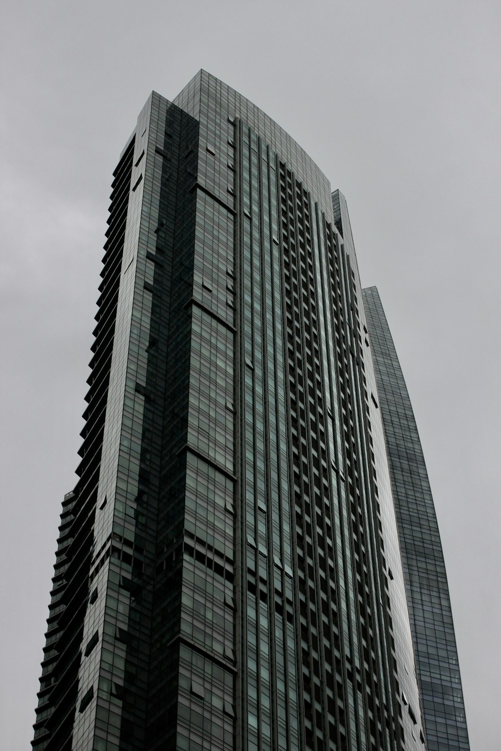 low-angle photography of black and gray concrete building