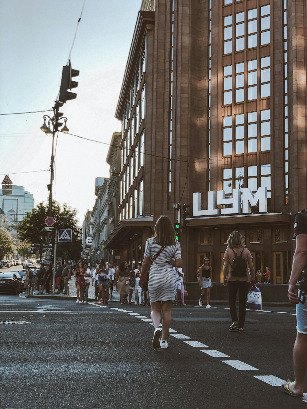 people crossing pedestrian near building