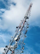 gray and red telecommunications tower