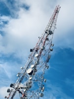 gray and red telecommunications tower