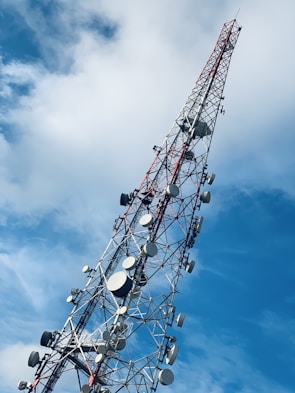 gray and red telecommunications tower