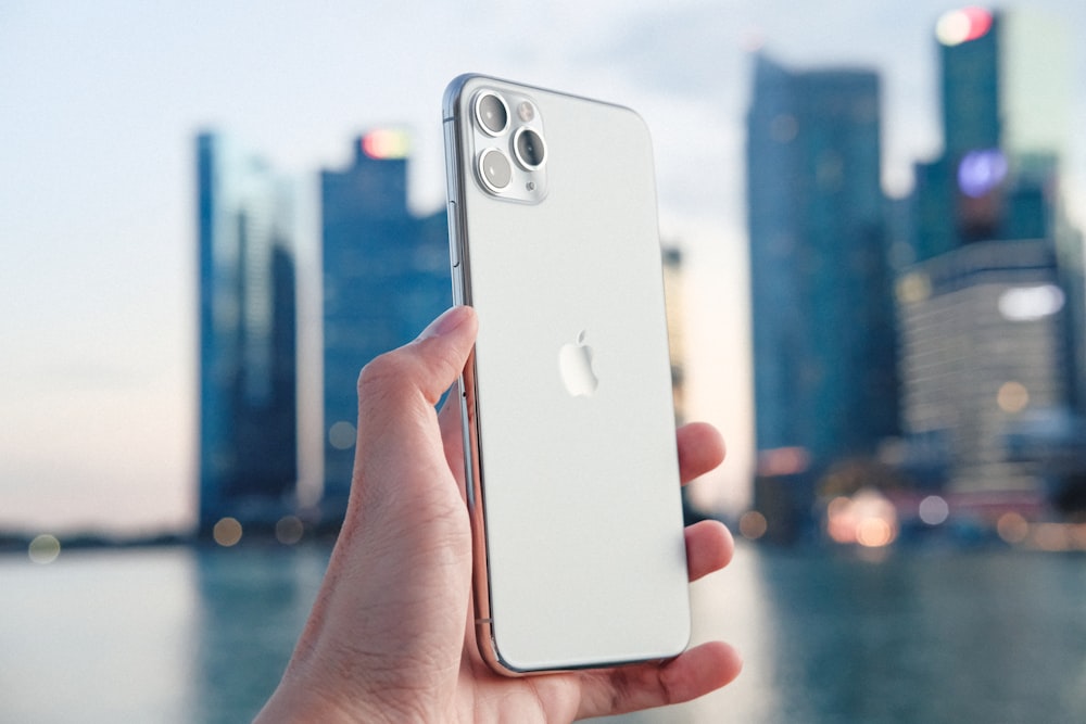 person holding silver iPhone 11 photo â€