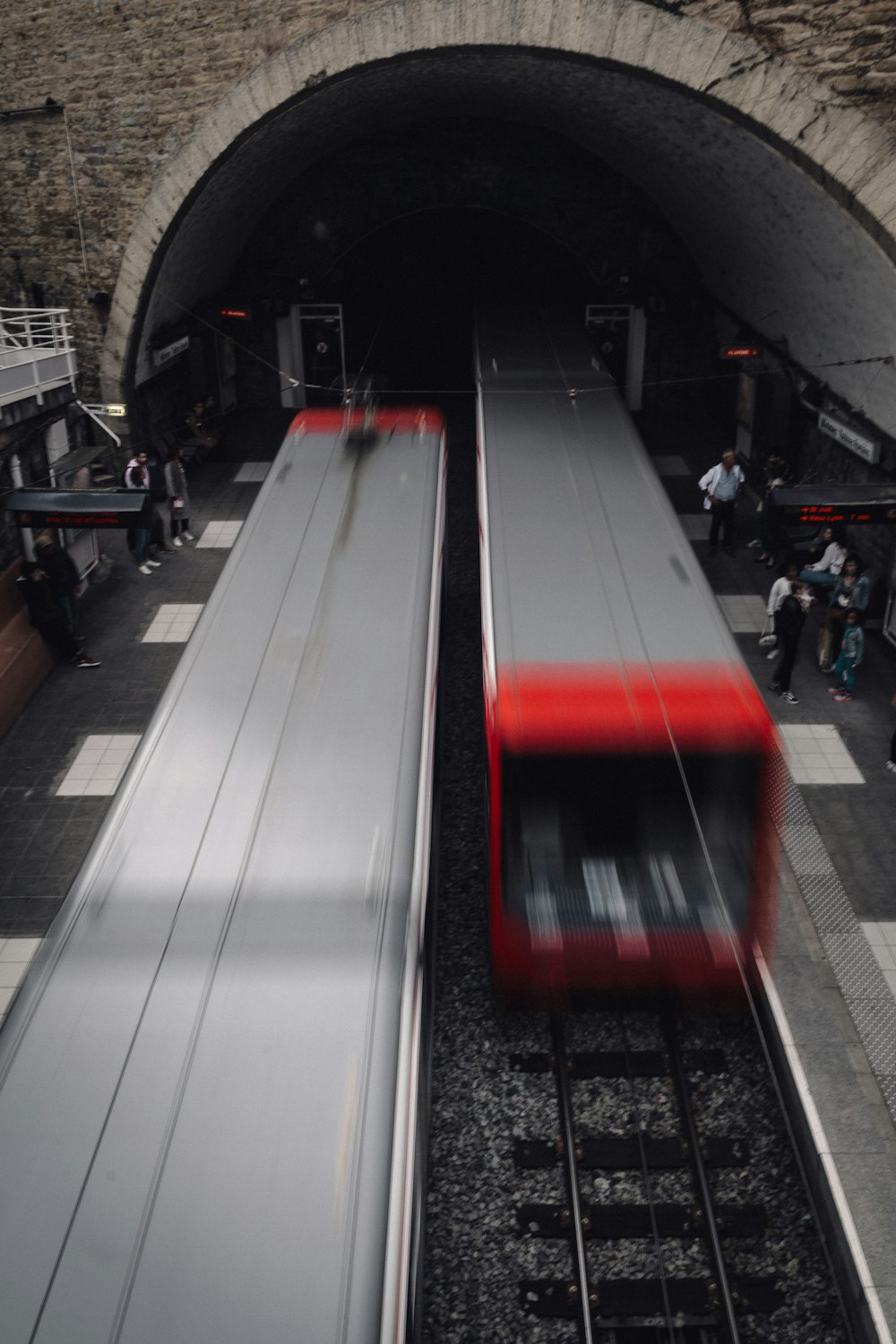 trains on road going into and out of the tunnel