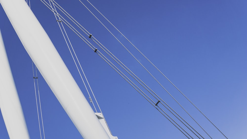 power lines and wires against a blue sky