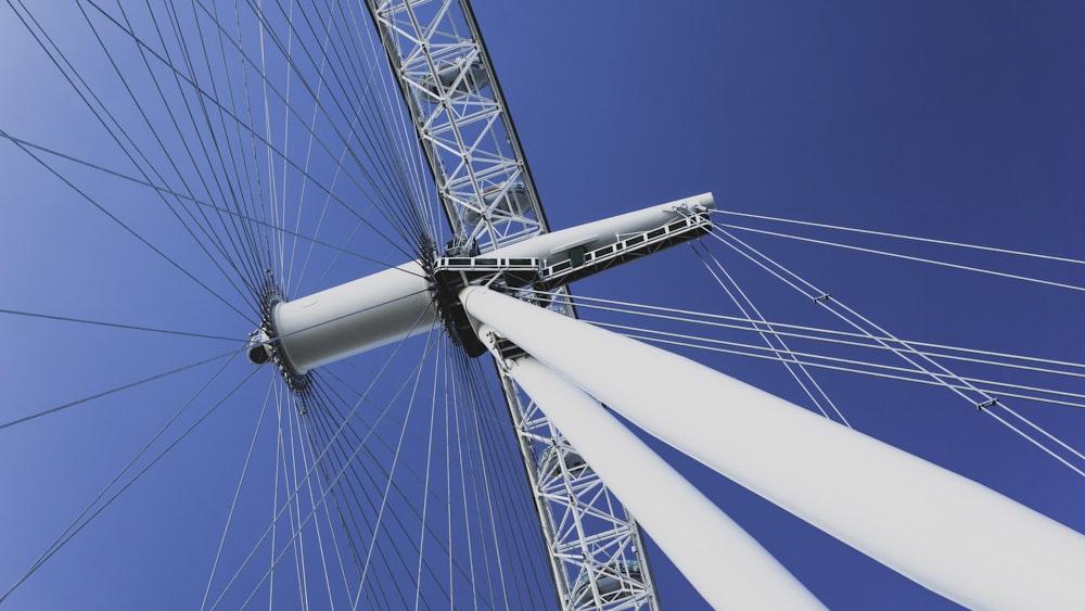 white Ferris wheel under clear blue sky