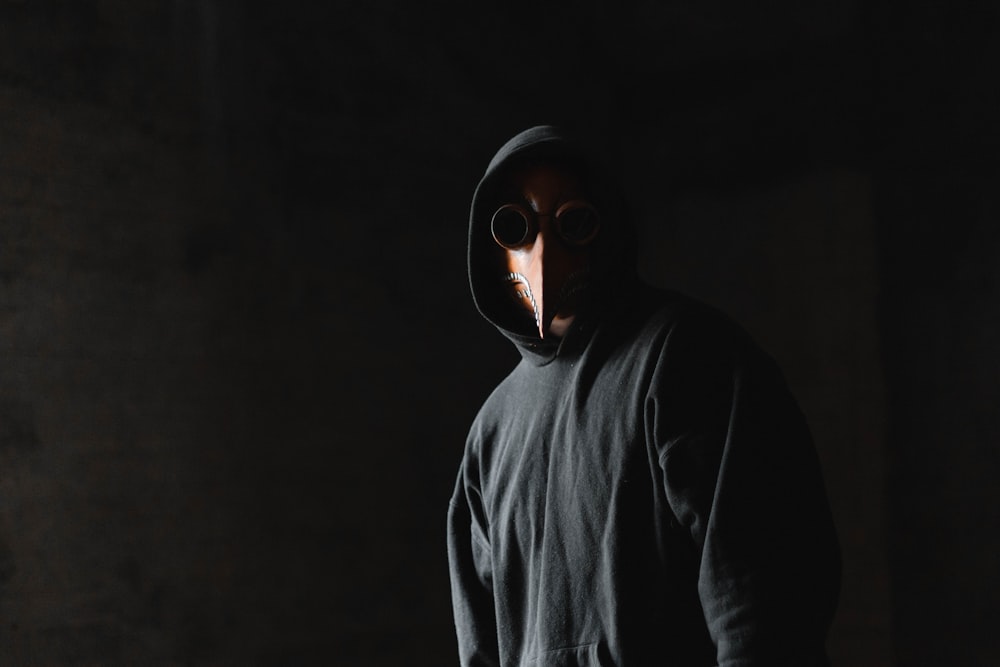 person wears black pullover hoodie