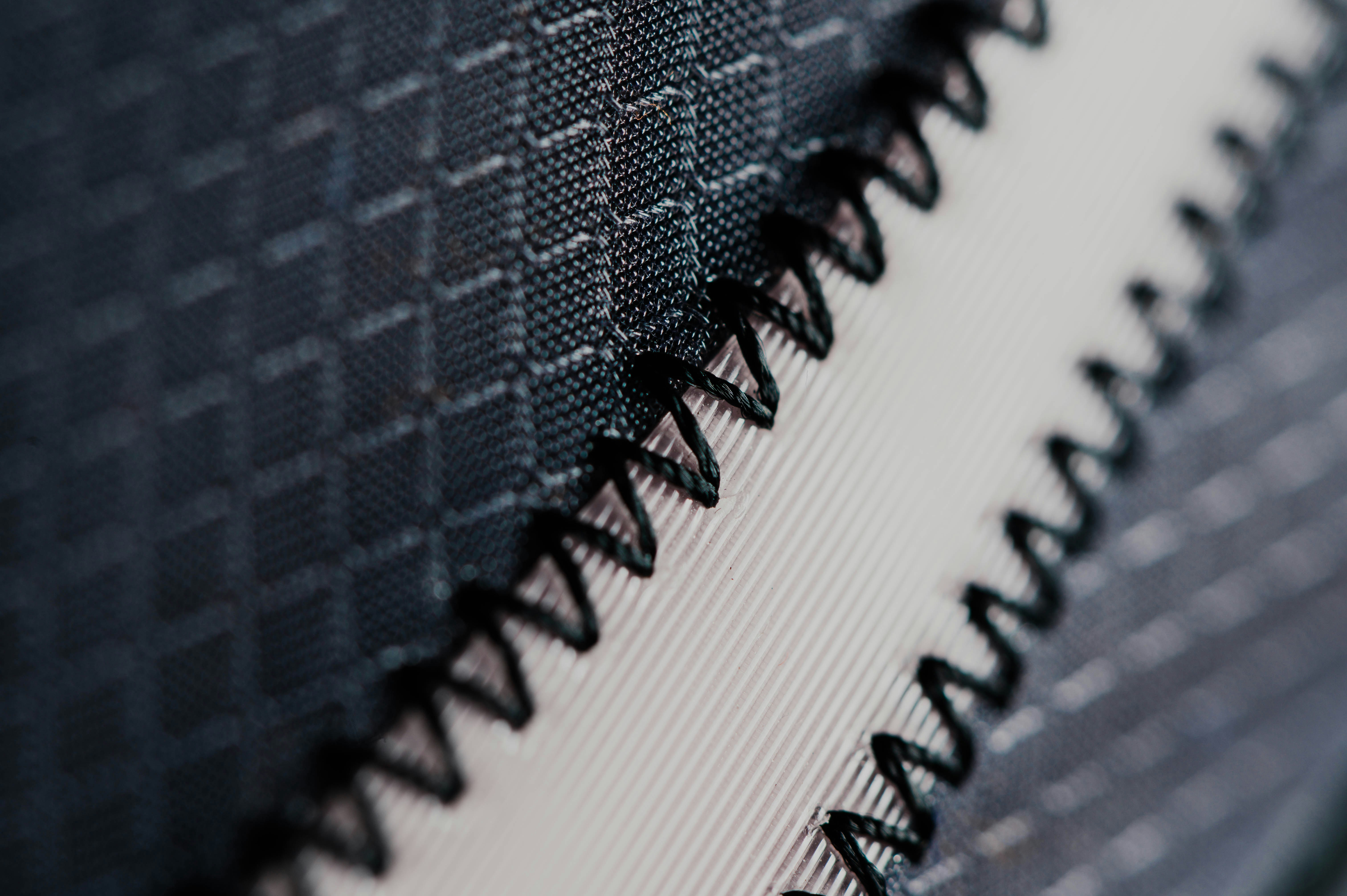 Detailed view of fabric swatches and certifications from a manufacturer