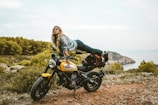 woman on yellow motorcycle