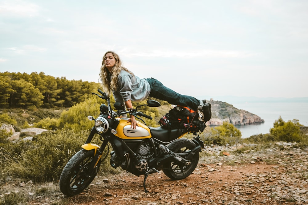 woman on yellow motorcycle