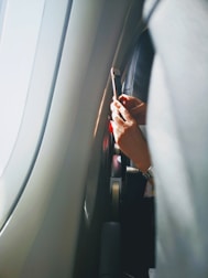 A happy passenger receiving a notification of successful flight compensation.