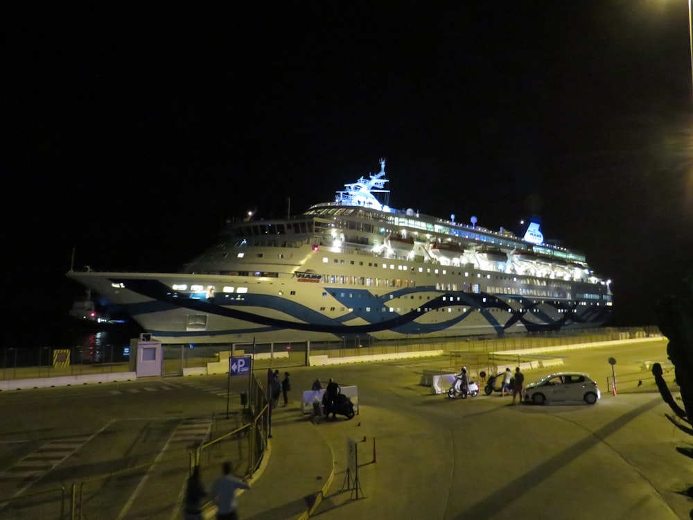 people near cruise ship during night time