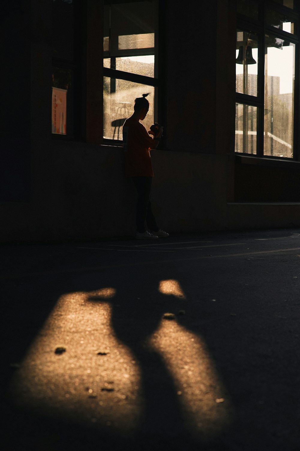 person standing near window