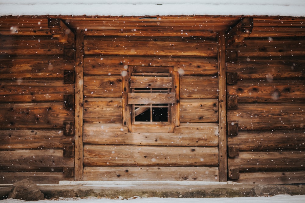 brown wooden house during winter season