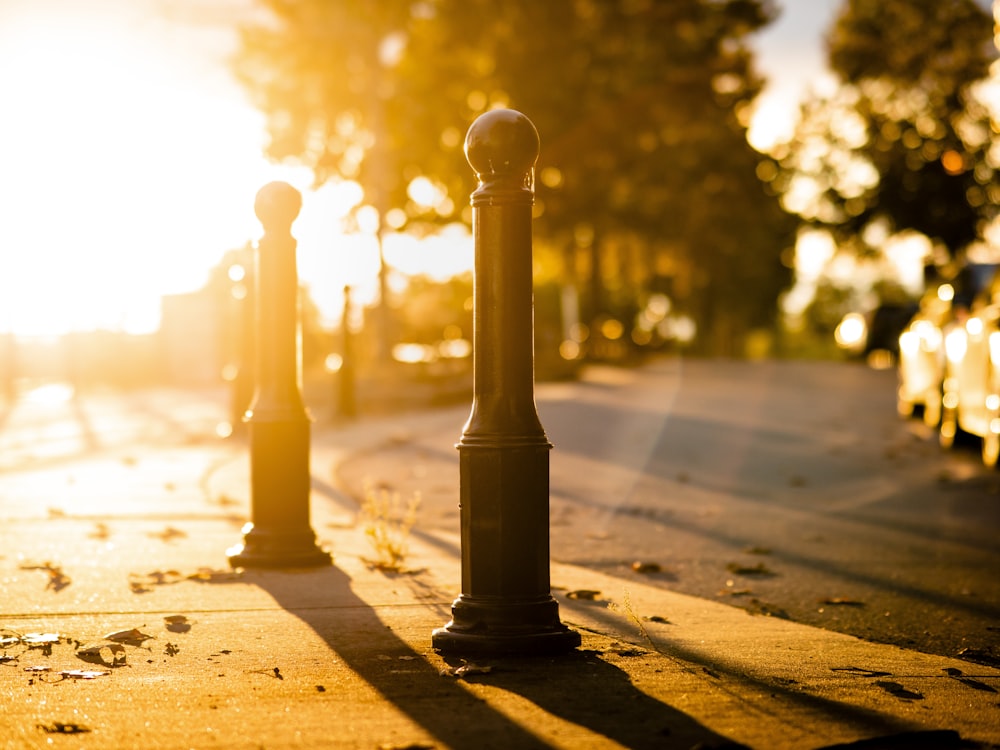 a street light sitting on the side of a road