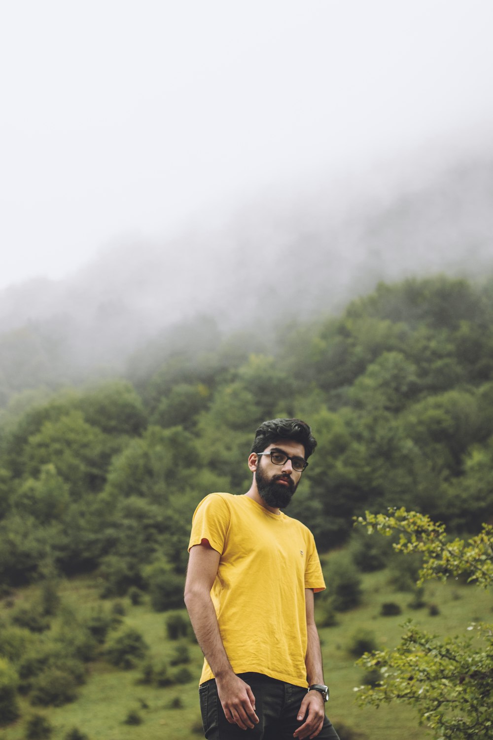 man wearing yellow crew-neck t-shirt