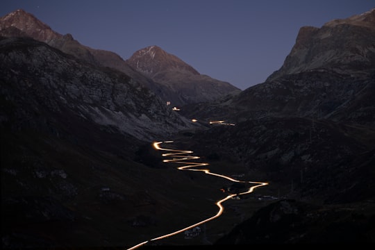 spiral road viewing mountain during night time in Julierpass Switzerland