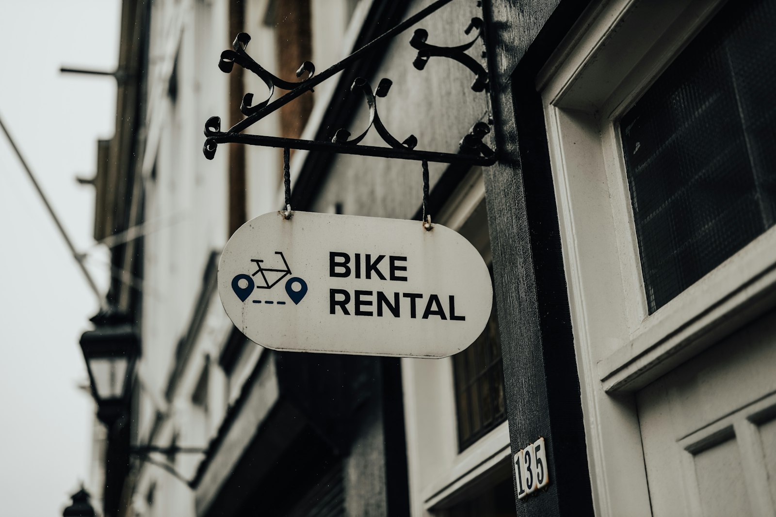 Canon RF 50mm F1.2L USM sample photo. Bike rental signage photography