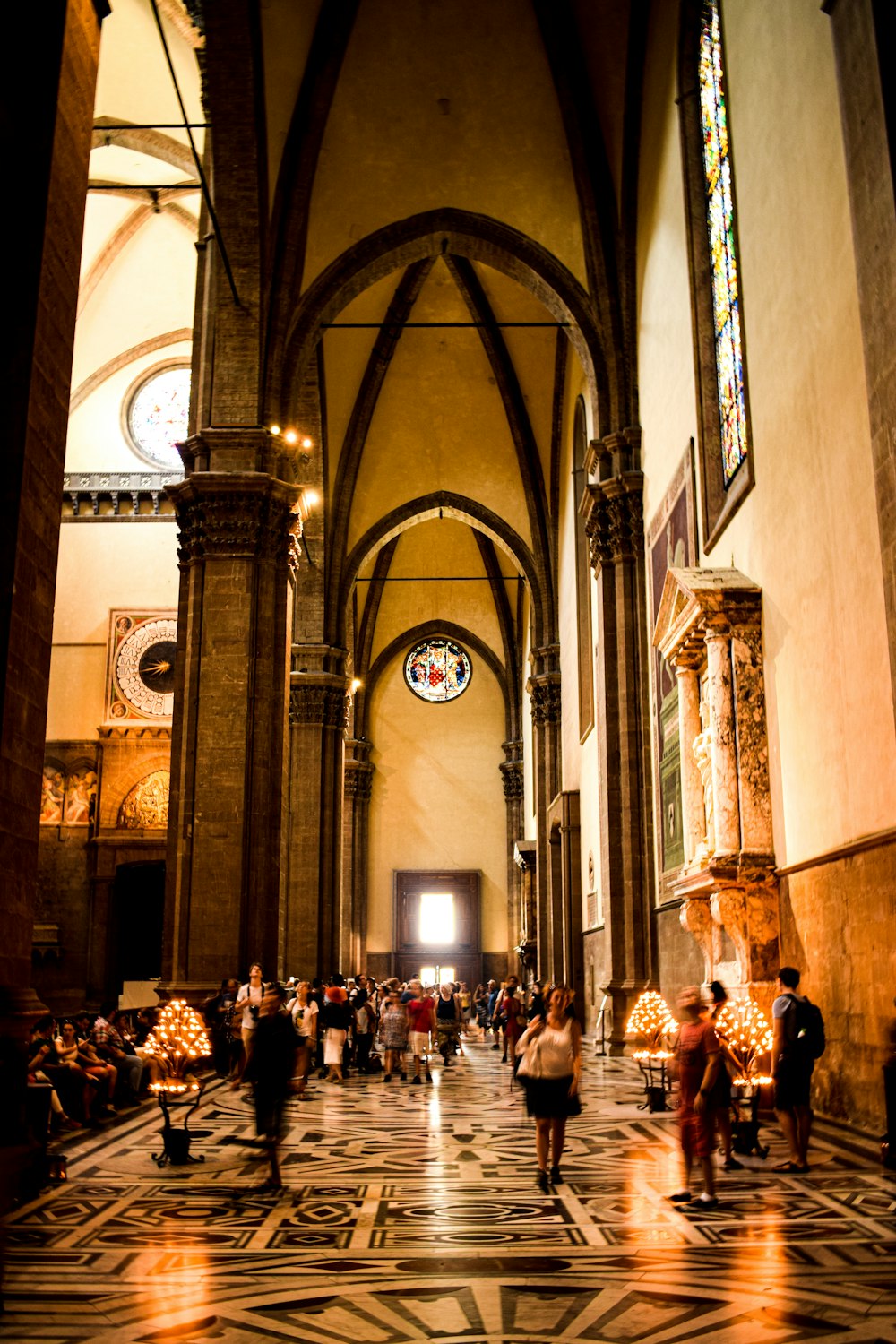 people inside a arch-roofed building