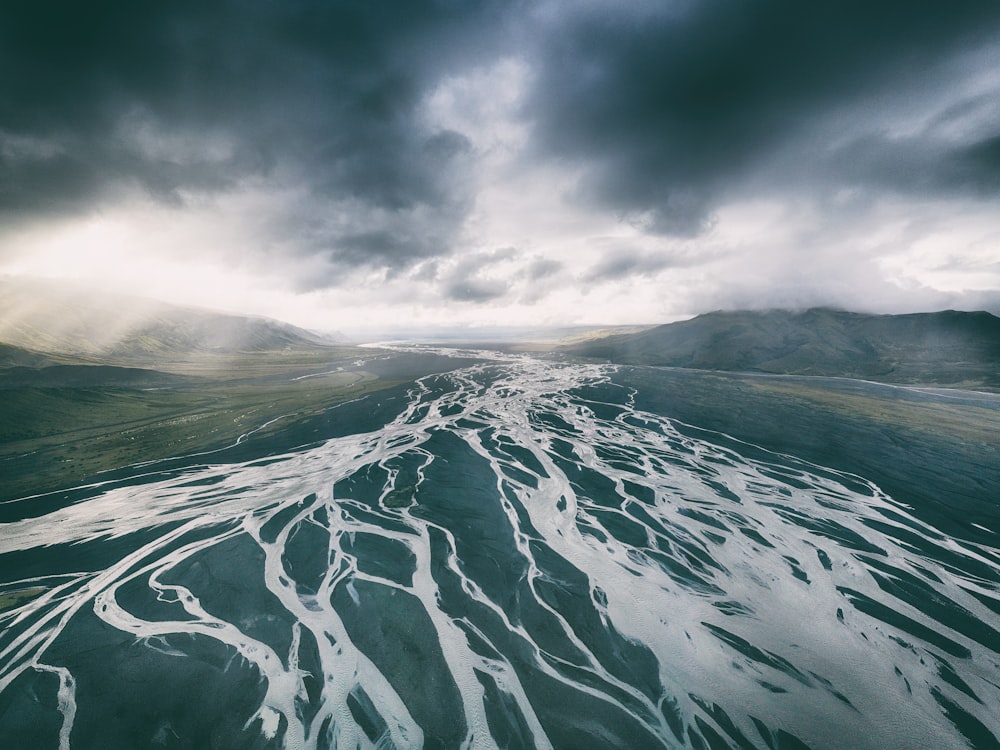 body of water under black sky