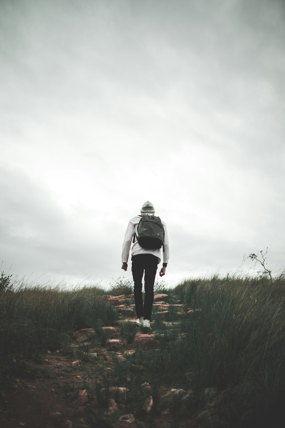 man wears black backpack