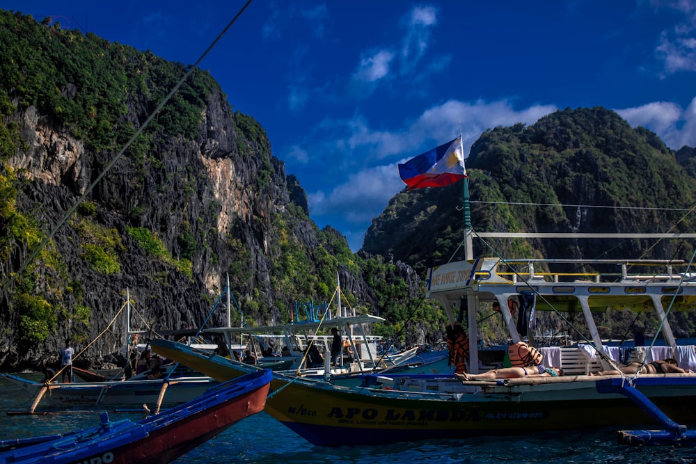 Philippine flag waving on yellow and green canoe boat