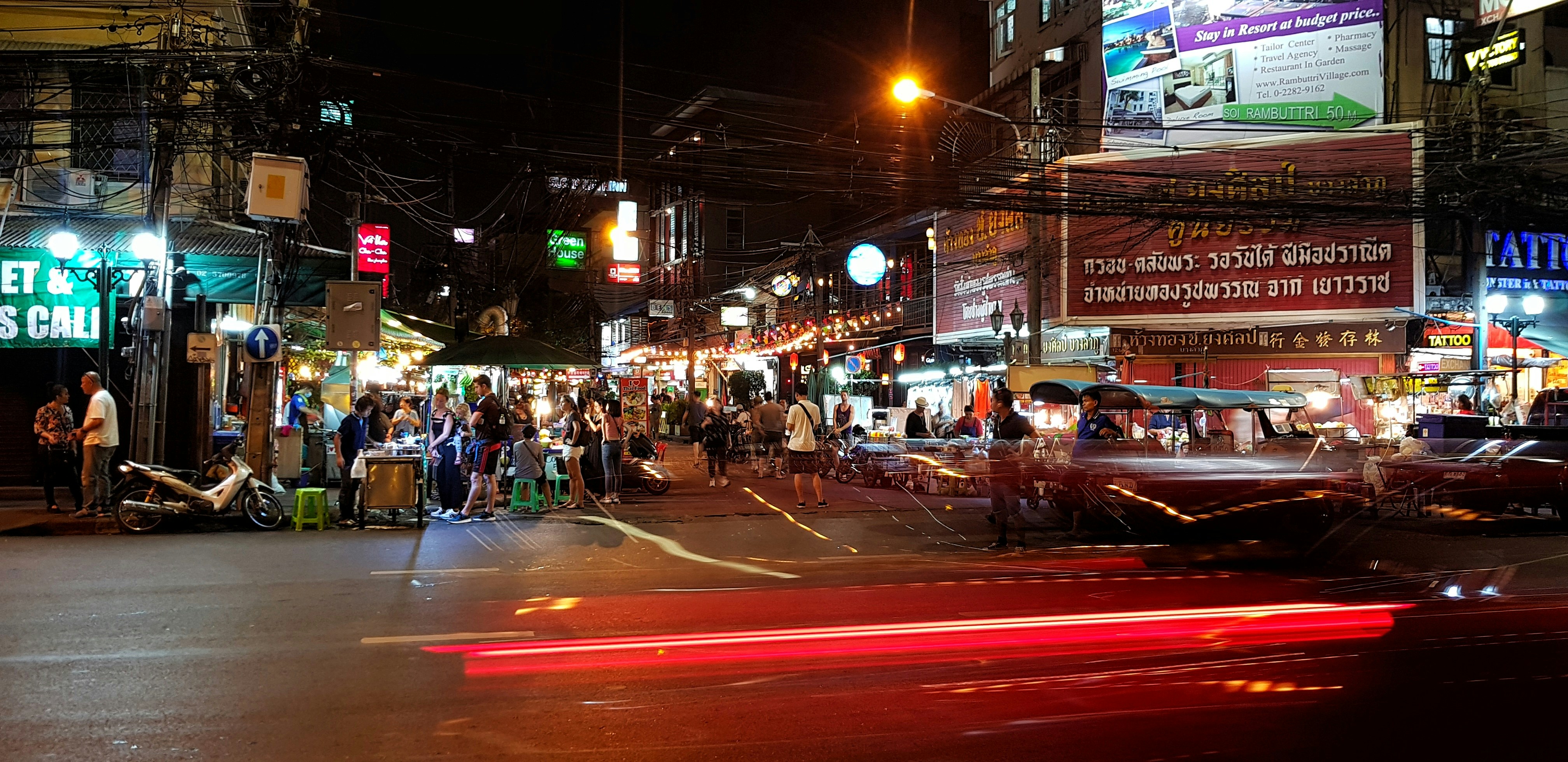 Neon-lit Yaowarat Road bustling with food carts and night crowds in Bangkok Chinatown
