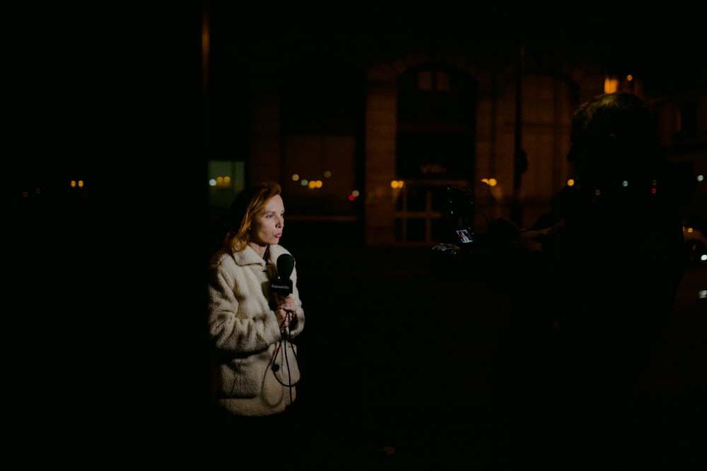 woman wearing brown coat