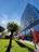 A well-maintained office building exterior with clear skies and warm sunlight.