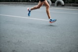 pair of blue-and-white Adidas running shoes