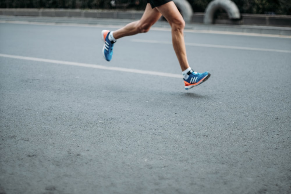 pair of blue-and-white Adidas running shoes photo – Free Running Image on  Unsplash